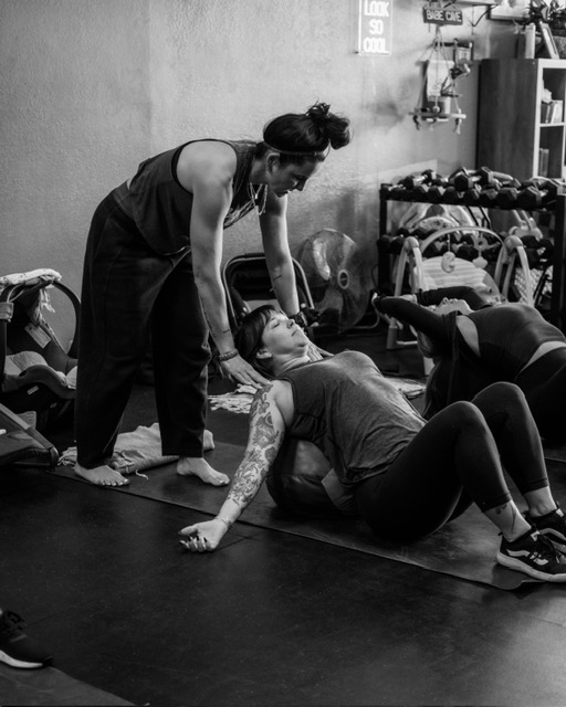 Nikki Adams providing hands-on coaching support during training at Cave Training in Santa Clarita California