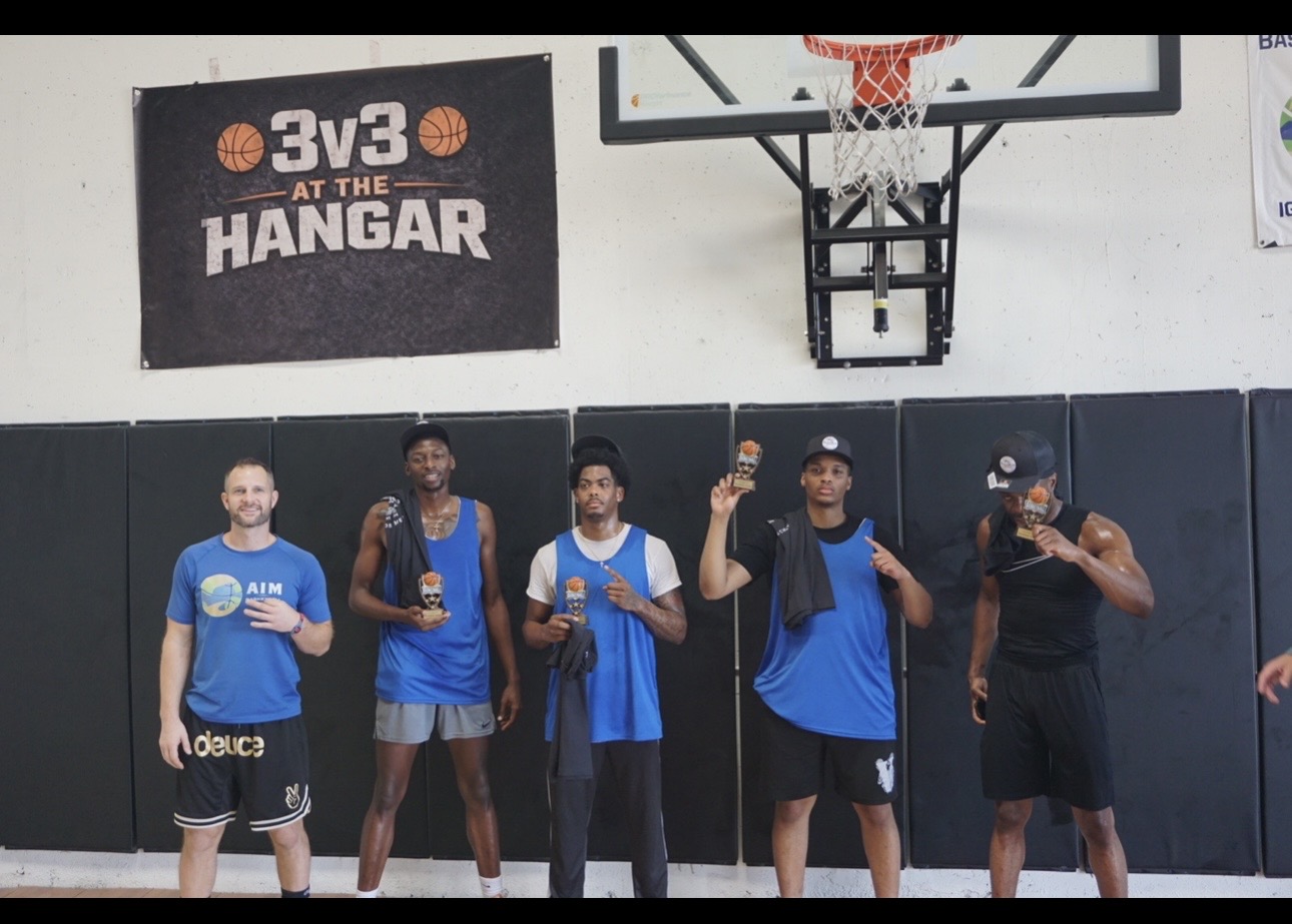 Basketball players holding awards at The Hangar in San Diego California