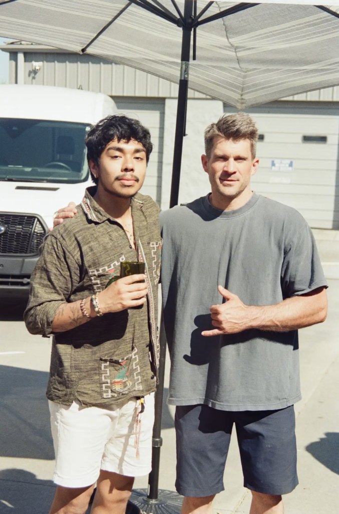 Isaac with Sean Herman outside the Musou Movement studio in Greenville