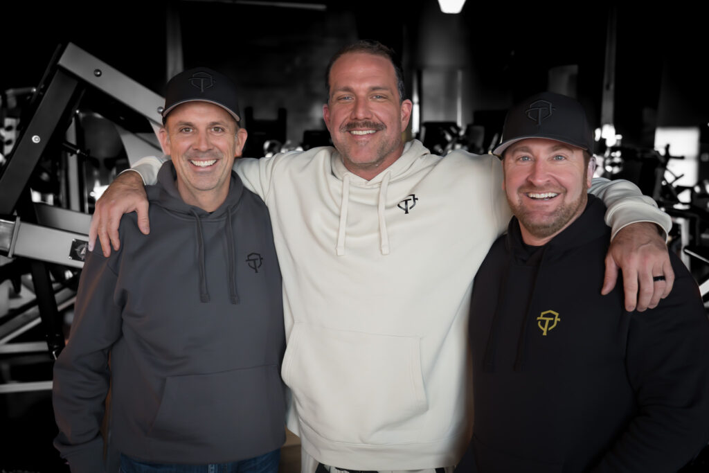 John Schwarze, Ryan Corder, and Bryan Lively inside Overtime Athletic Club