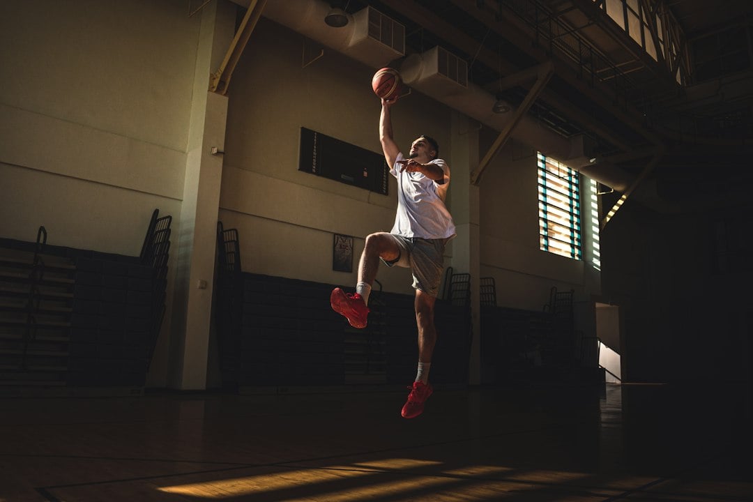 Athlete jumping in the air, the countermovement jump outcome measured after resistance priming