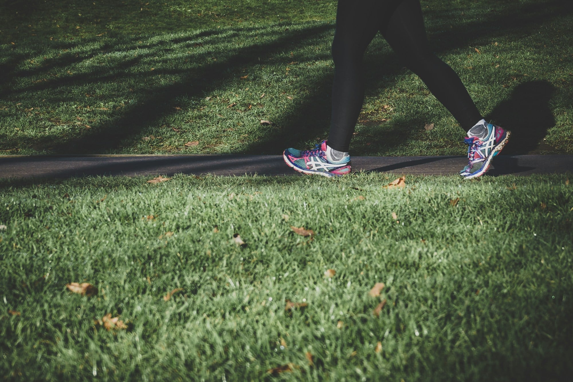 Woman running on a park path, an everyday way to add vigorous activity to the week