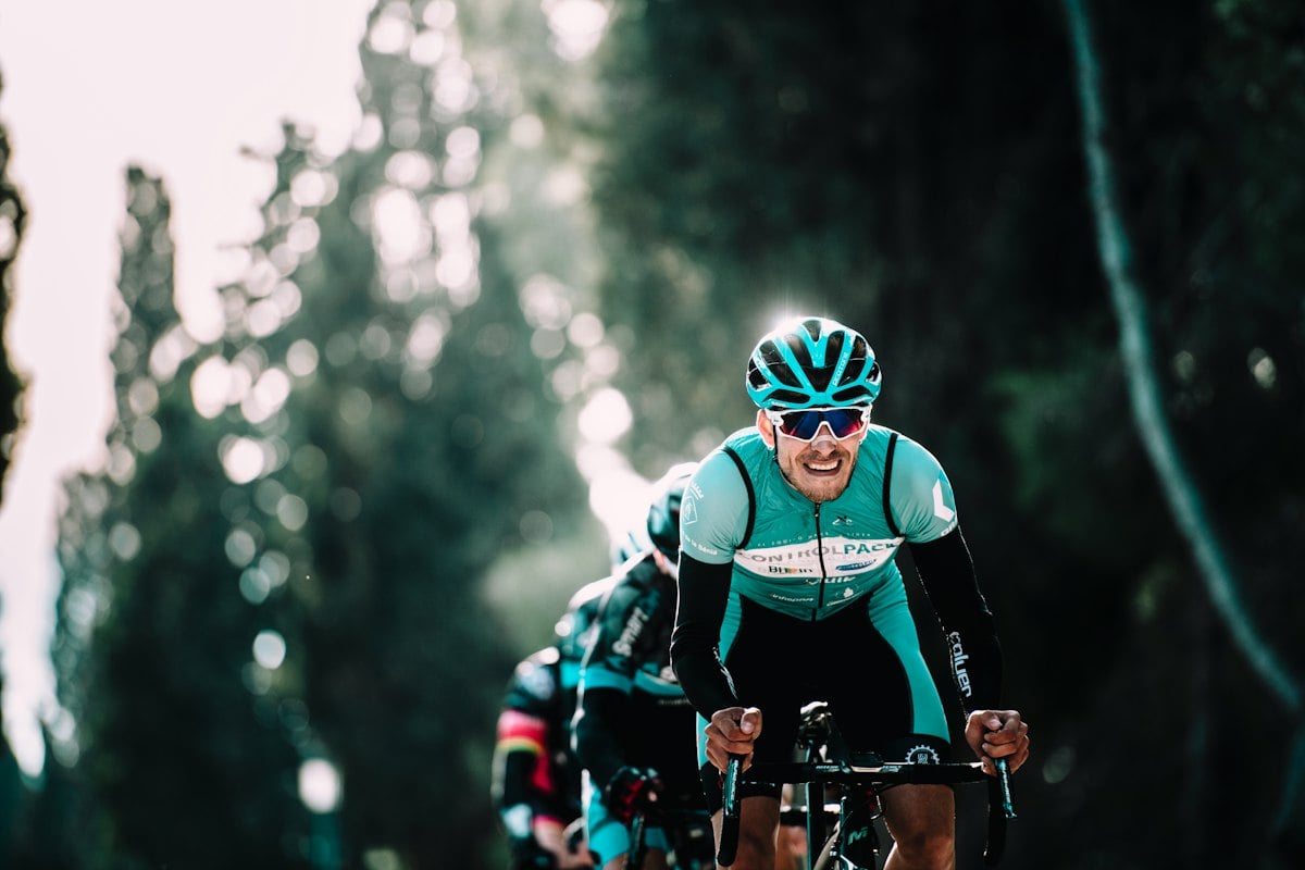 Cyclist riding a bicycle on a road, the category with the highest hospitalization share alongside exercise-related injuries
