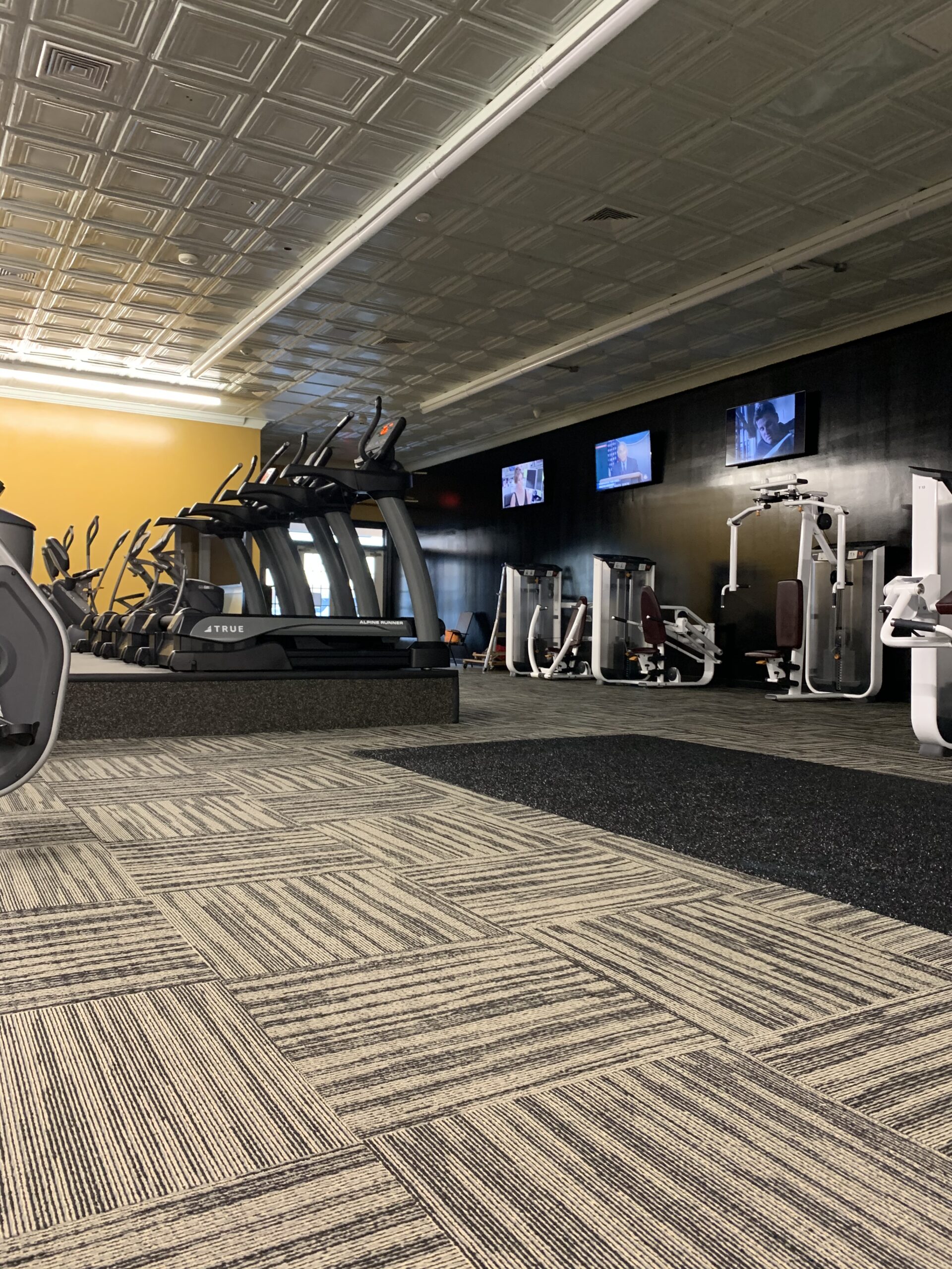 Cardio and strength equipment inside G Fitness in Greer