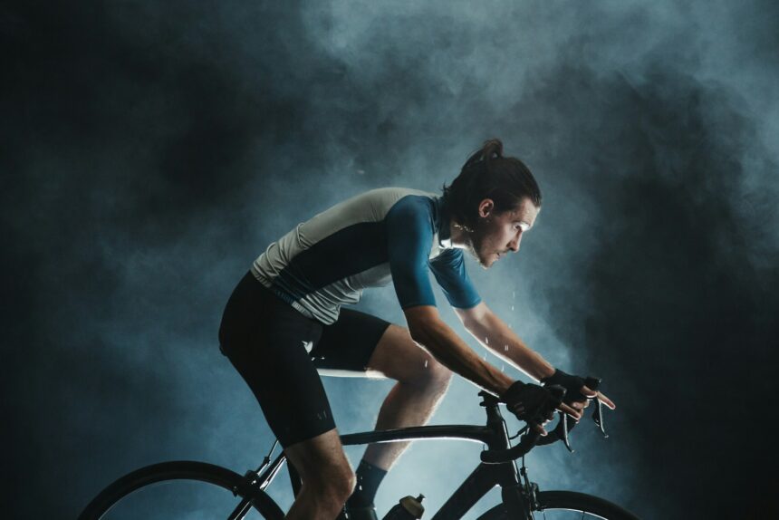 Cyclist riding indoors during a study of muscle activation in incremental cycling