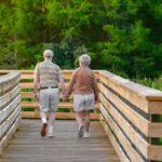 Two adults walking together outdoors during leisure-time exercise