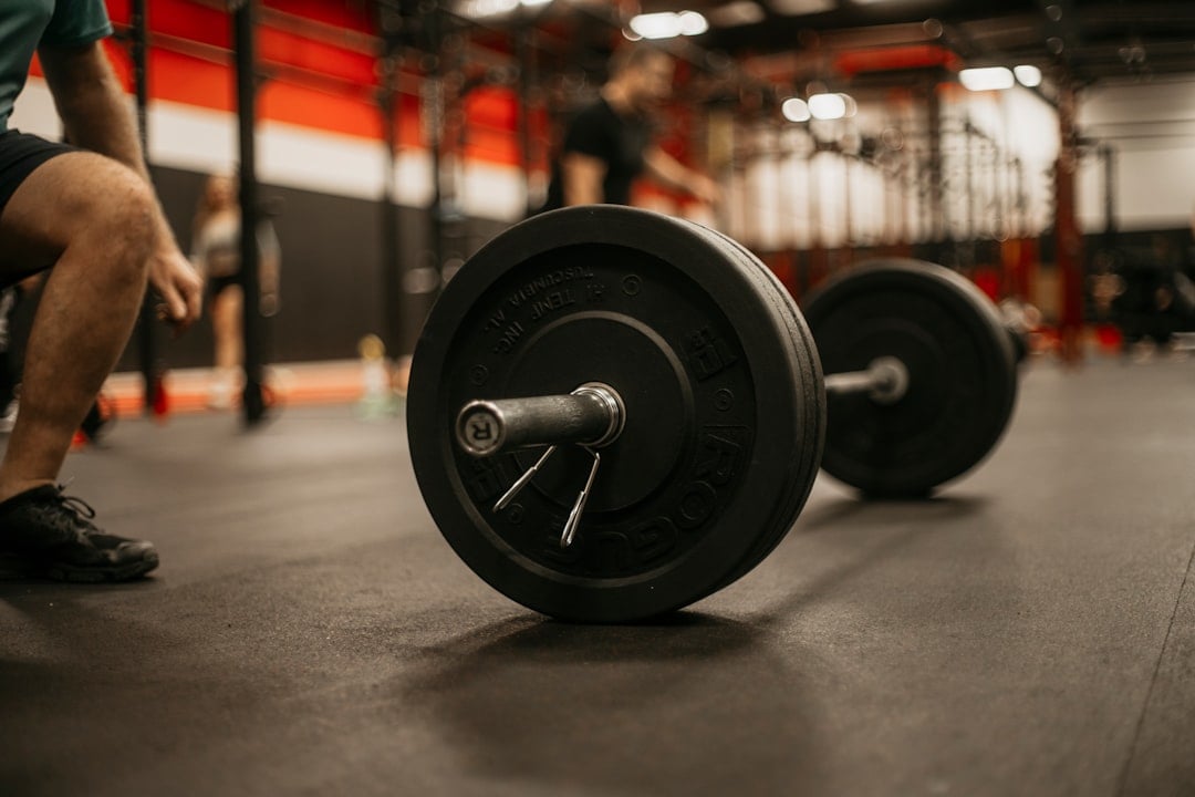 A lifter setting up for a barbell squat, illustrating muscle growth research in young athletes