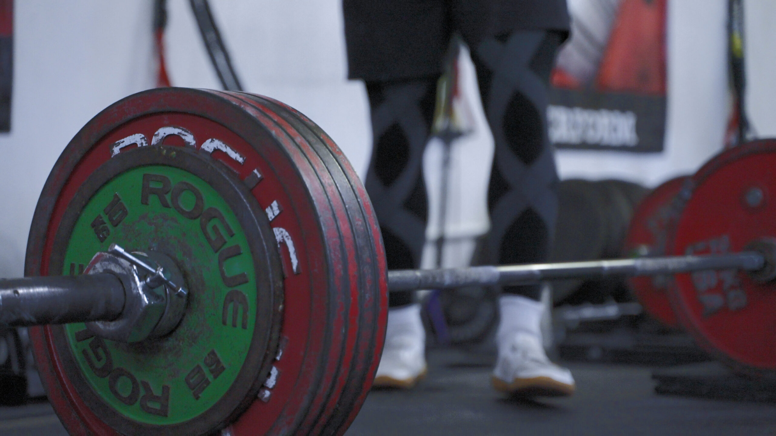 A loaded barbell prepared for strength training inside The Weight Room in Pleasanton