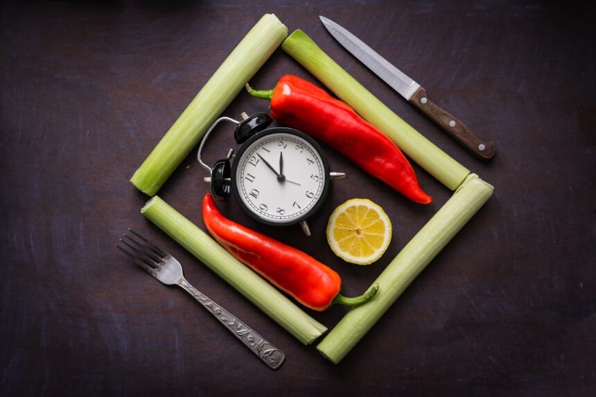 Healthy food arranged around a clock to represent meal timing