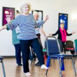 Older adults in a group exercise class, illustrating reactive balance training and mobility work
