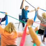 Older adults taking part in a group fitness class, illustrating short exercise sessions for healthy aging