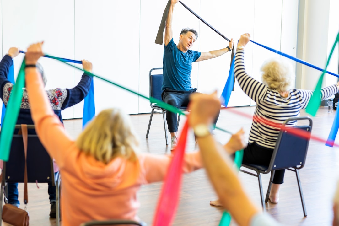 Older adults taking part in a group fitness class, illustrating short exercise sessions for healthy aging