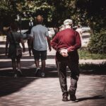 Older adult walking outdoors, illustrating physical activity and healthy ageing