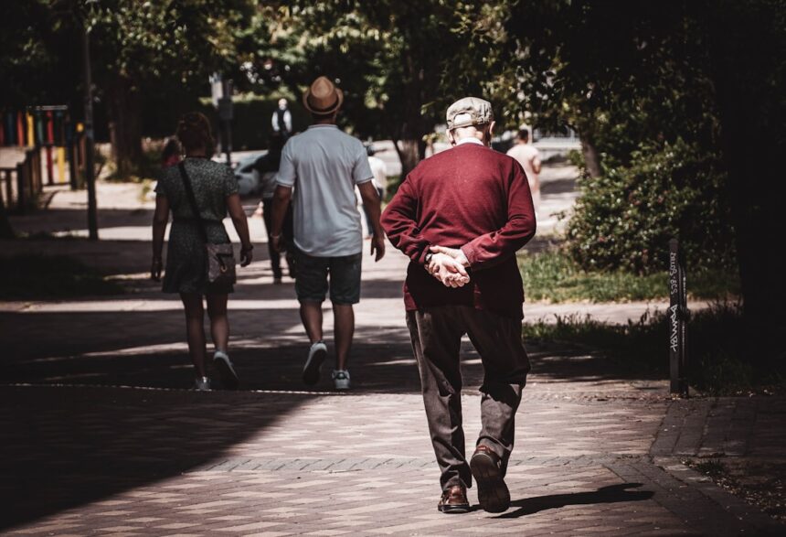 Older adult walking outdoors, illustrating physical activity and healthy ageing