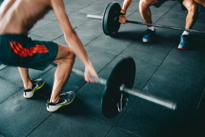 Resistance training muscle hypertrophy study with an athlete lifting a barbell