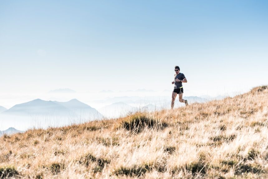 Runner on a mountain trail, illustrating hypoxic training at altitude