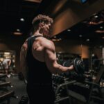 Athlete strength training in a gym, illustrating isometric resistance training adaptations