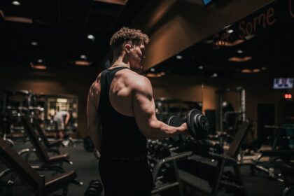 Athlete strength training in a gym, illustrating isometric resistance training adaptations