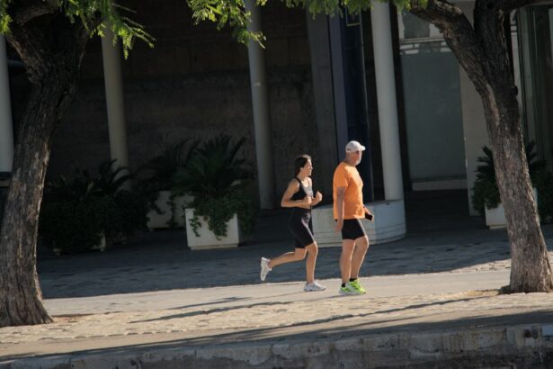 Two adults running along a street, reflecting the everyday habits behind cardiorespiratory fitness