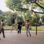 Adolescent basketball players in a conditioning session that trains aerobic capacity