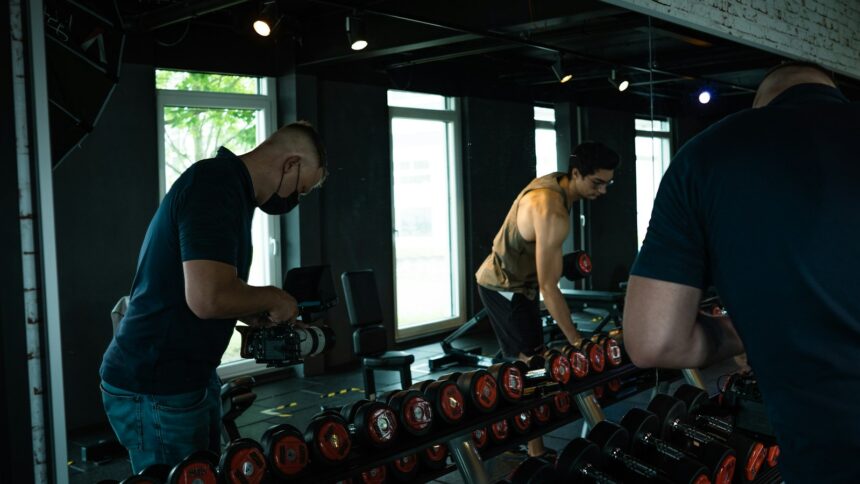 Adults lifting weights in a gym, illustrating exercise trials in adults with metabolic syndrome
