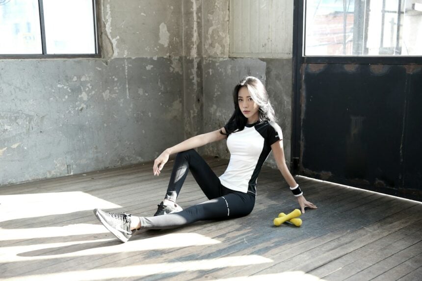 An athlete sitting on the floor stretching the hamstrings, the comparison condition in the myofascial release trial