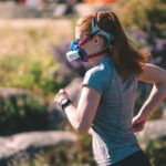 Endurance athlete running on an outdoor track during physiological testing, the population in which t-wave inversions are screened