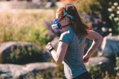 Endurance athlete running on an outdoor track during physiological testing, the population in which t-wave inversions are screened