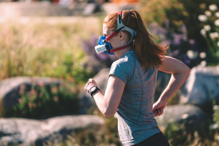 Endurance athlete running on an outdoor track during physiological testing, the population in which t-wave inversions are screened