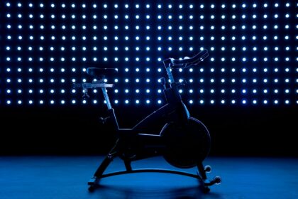 Stationary exercise bike against a blue background