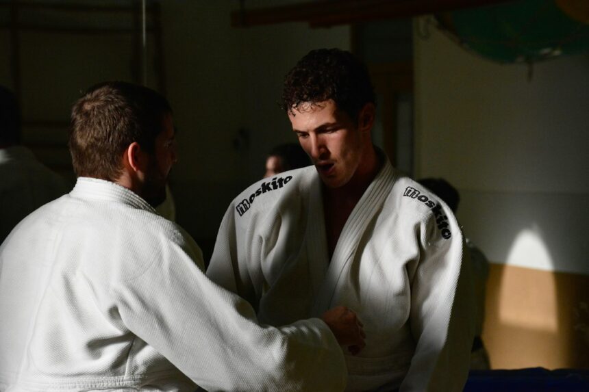 Judo athletes training on the mat, the combat sports setting where reaction time was measured