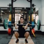 Lifter controlling the lowering phase of a squat, the movement pattern used in eccentric training