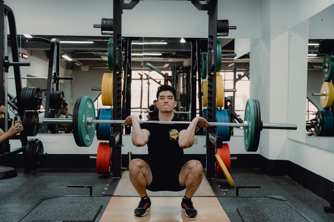 Lifter controlling the lowering phase of a squat, the movement pattern used in eccentric training