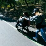 Mother and child walking a park path, illustrating postpartum exercise habits followed for four years