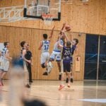 Players contesting a rebound in a match, the kind of load that countermovement jump testing is used to monitor