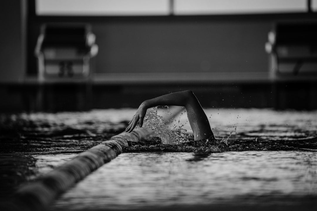 A swimmer moving through pool water during training, the exposure setting counted for artistic swimmers in the study