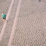 A recreational runner mid-stride on a city path, the population studied in gait retraining research