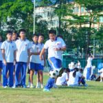 School children playing soccer in a setting used for motor fitness testing