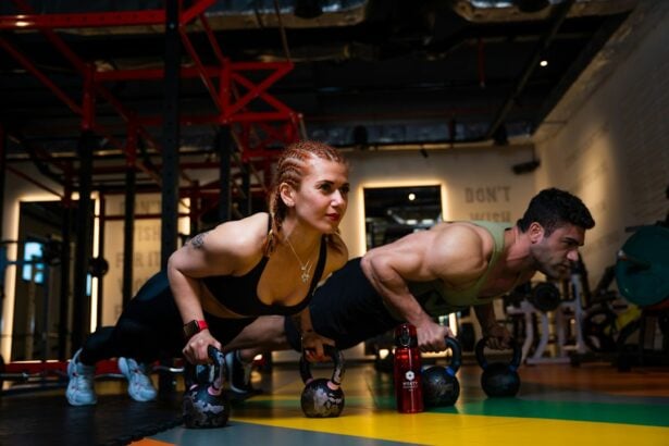 Two athletes holding a push-up position on a gym floor during core training