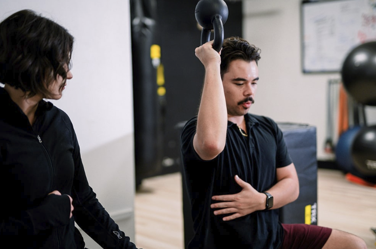 A client training session at Top Tyr Training in Torrance, coached one-on-one