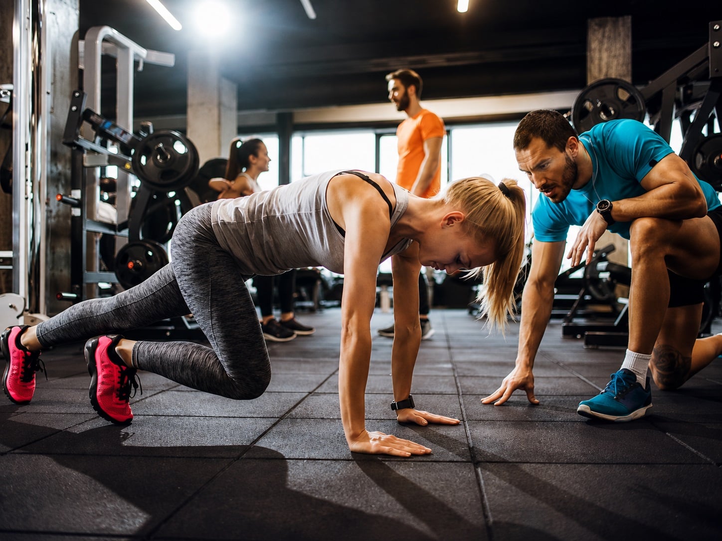Members and trainers sharing the uncrowded floor at Transform Fitness in Los Angeles